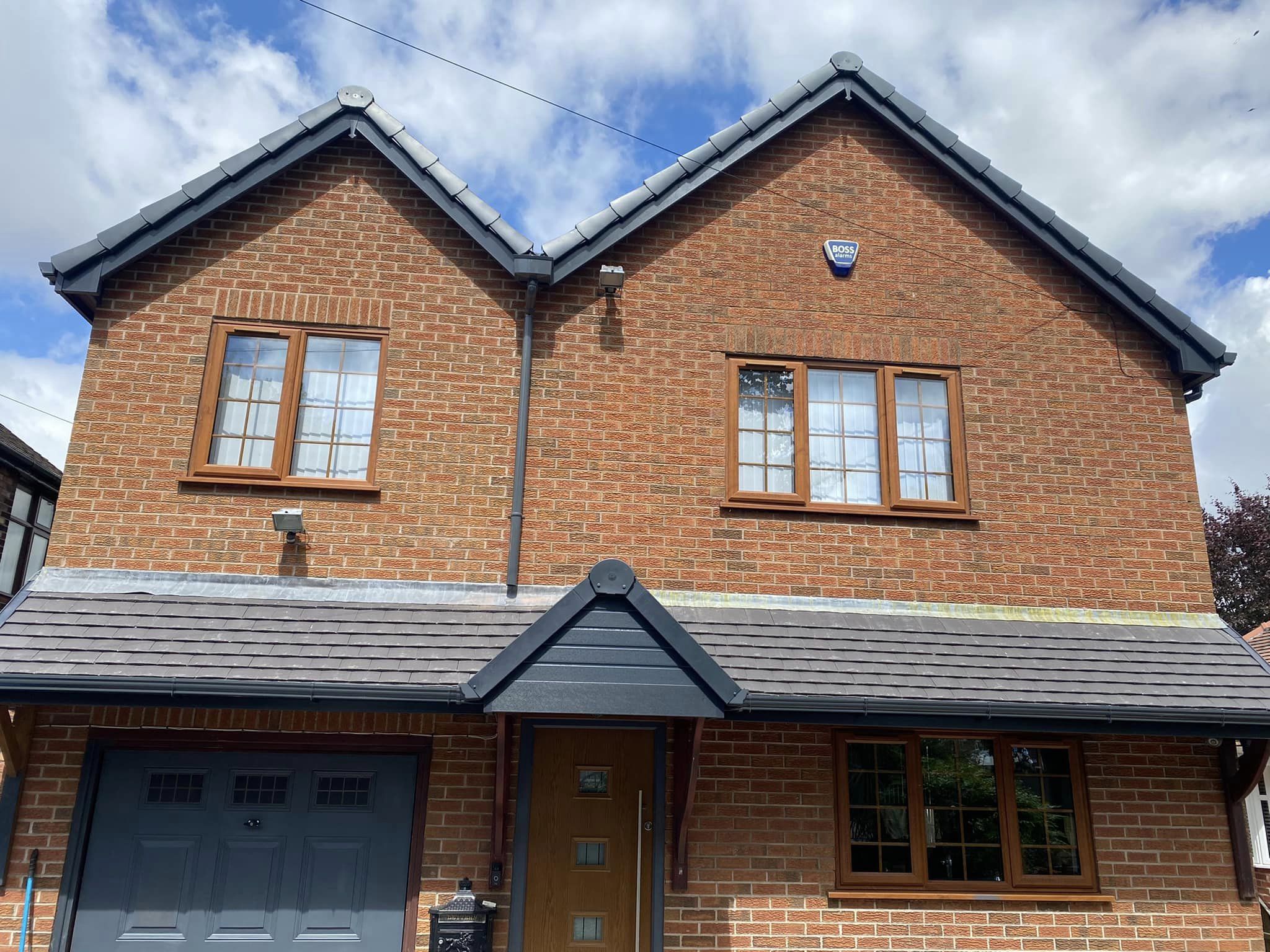 Brick house with newly installed roof