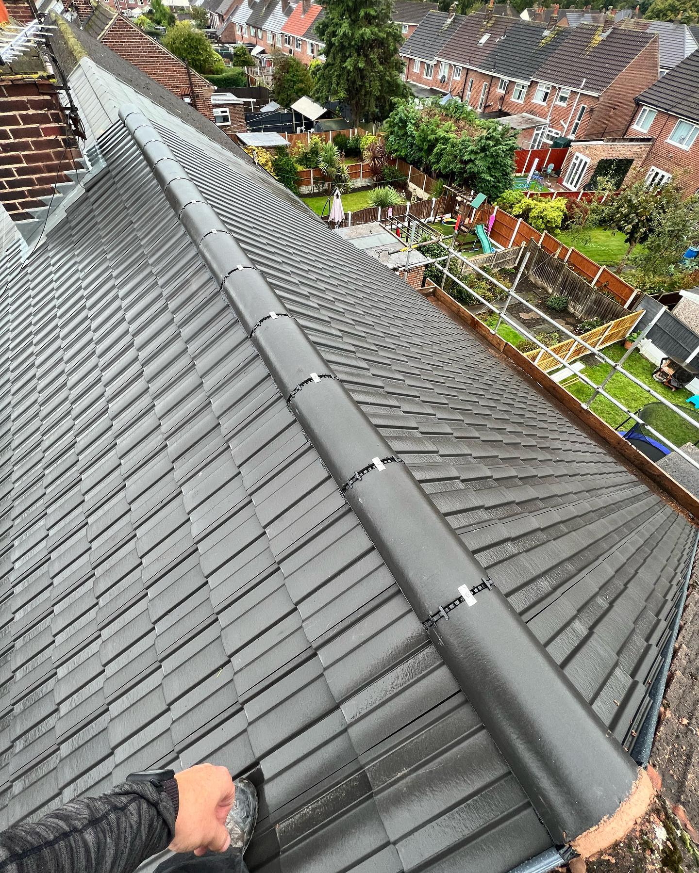 Newly installed roof tiles close up from above