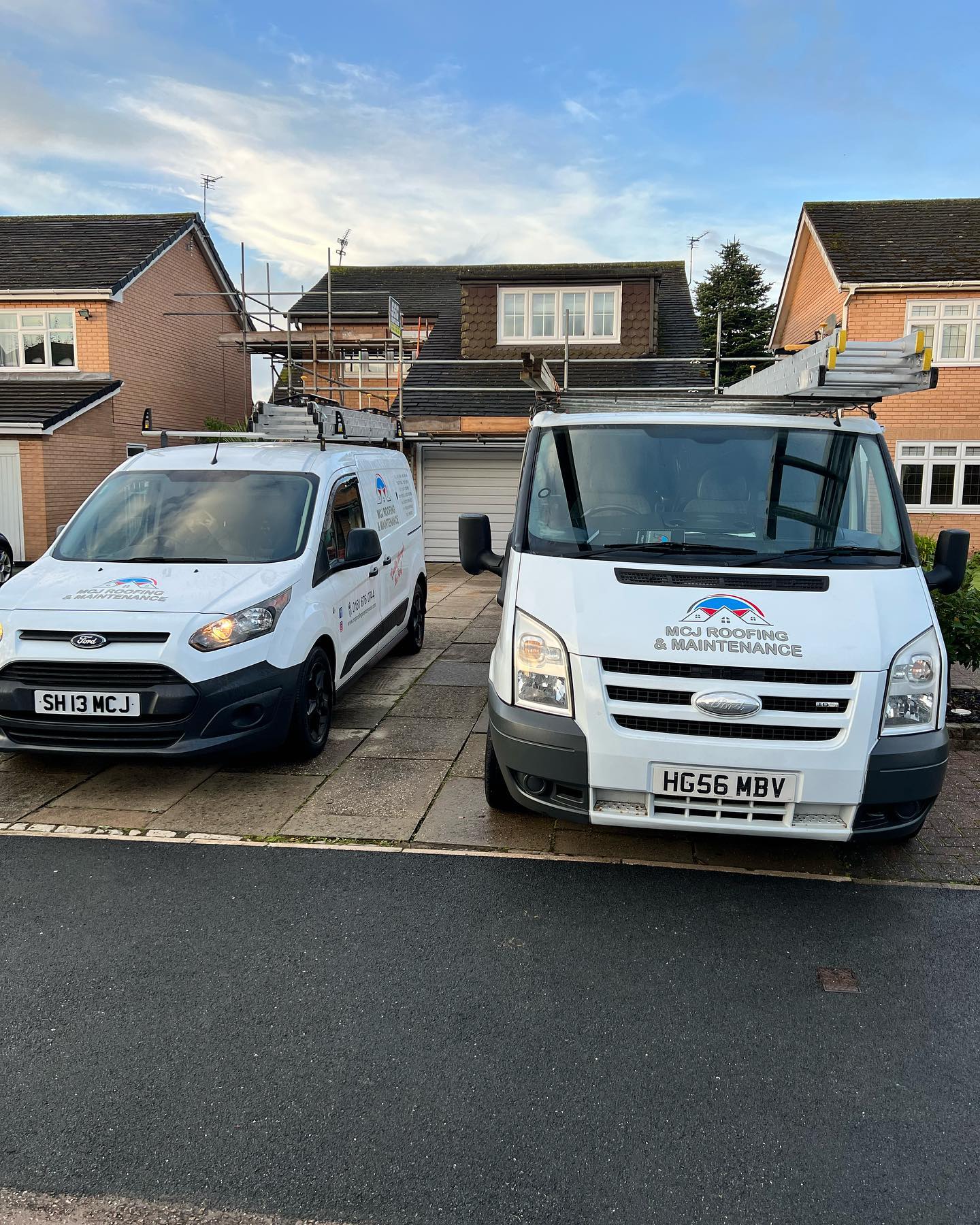Two MCJ Roofing & Maintenance vans
